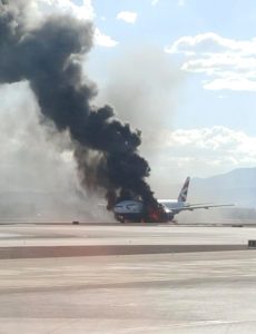 epa04921112 A handout photo from Twitter user Bradley Hampton used with permission shows British Airways flight 2276 en route to London's Gatwick Airport on fire at McCarran International Airport in Las Vegas, Nevada, USA, 08 September 2015.  Media reports indicate that the Boeing 777's engine caught fire and that all 159 passengers and 13 crew were evacuated with just two minor injuries reported.  EPA/BRADLEY HAMPTON via TWITTER  HANDOUT EDITORIAL USE ONLY/NO SALES